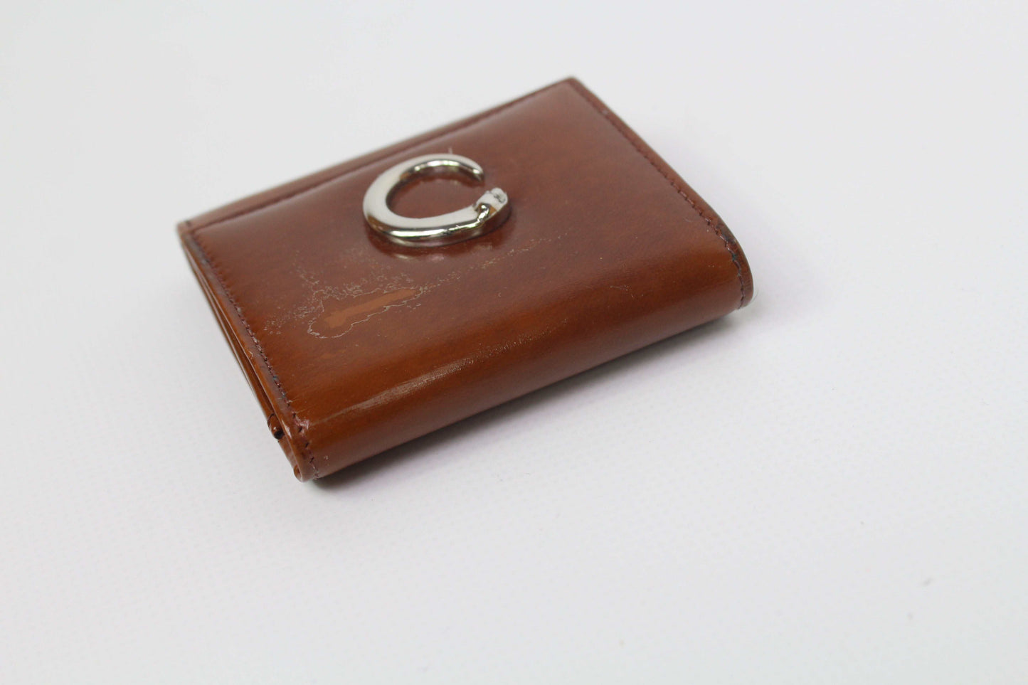 Cartier Portmonee Orange wallet, dark orange leather, 8x8cm, used condition with original box.
