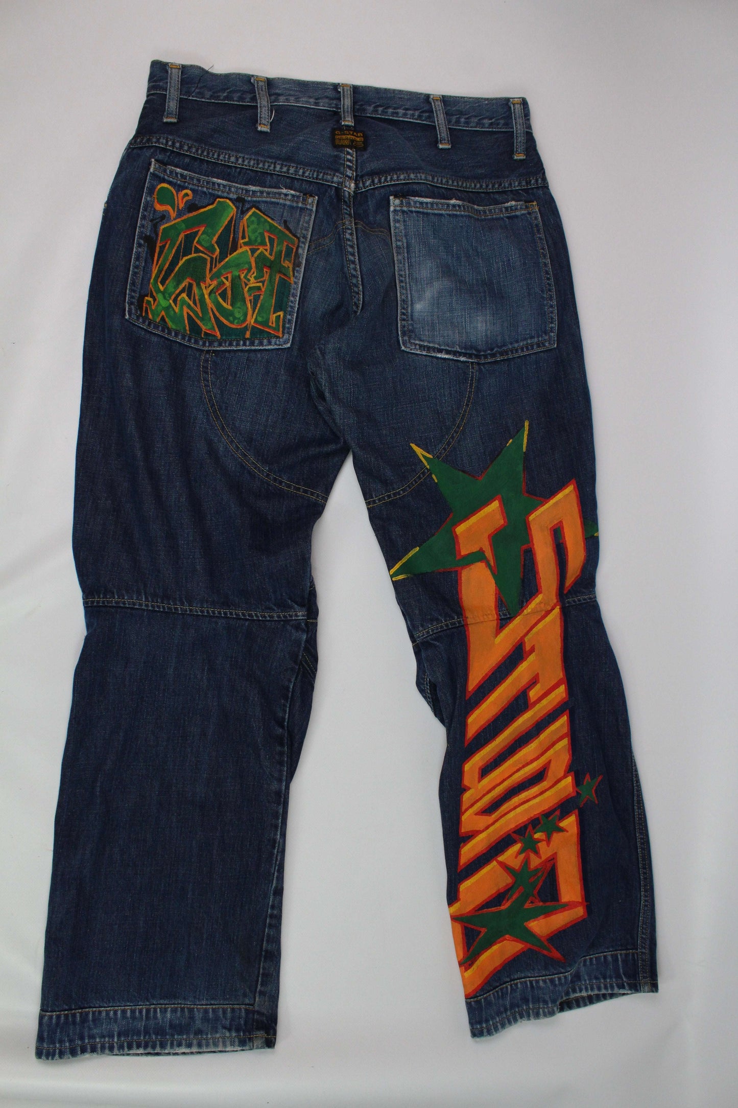 Custom painted G-Star jeans with unique design, size 32x32, straight fit, blue color, cotton material.
