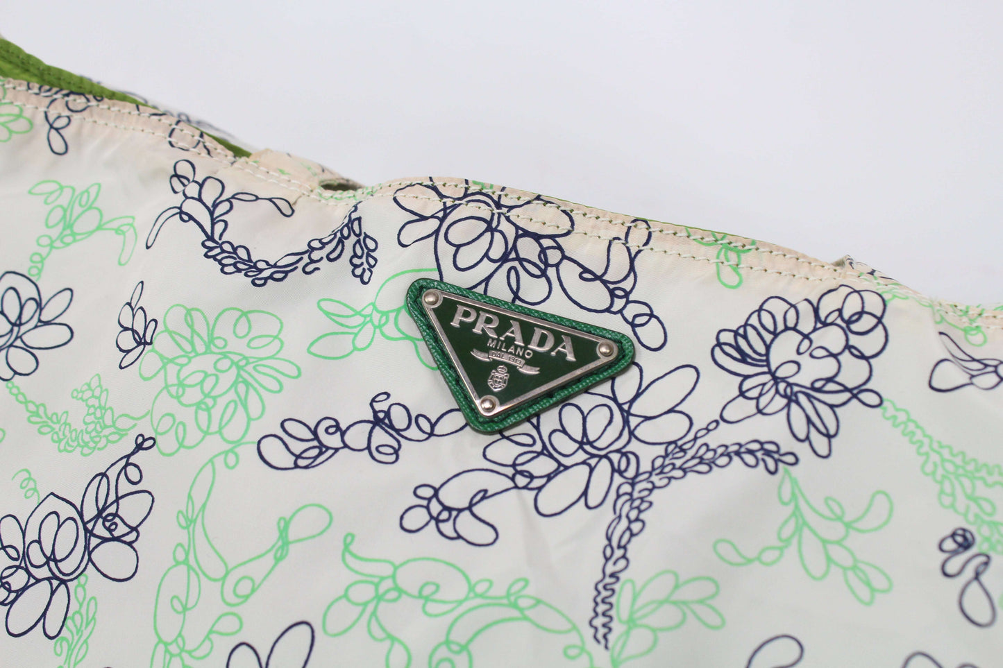 PRADA Shopper Green/White floral nylon bag with logo and slight imperfections.