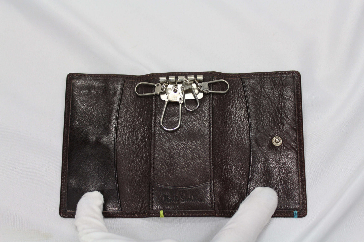 Paul Smith Keyholder in very good condition, size 11x6cm, brown leather with multiple key hooks.