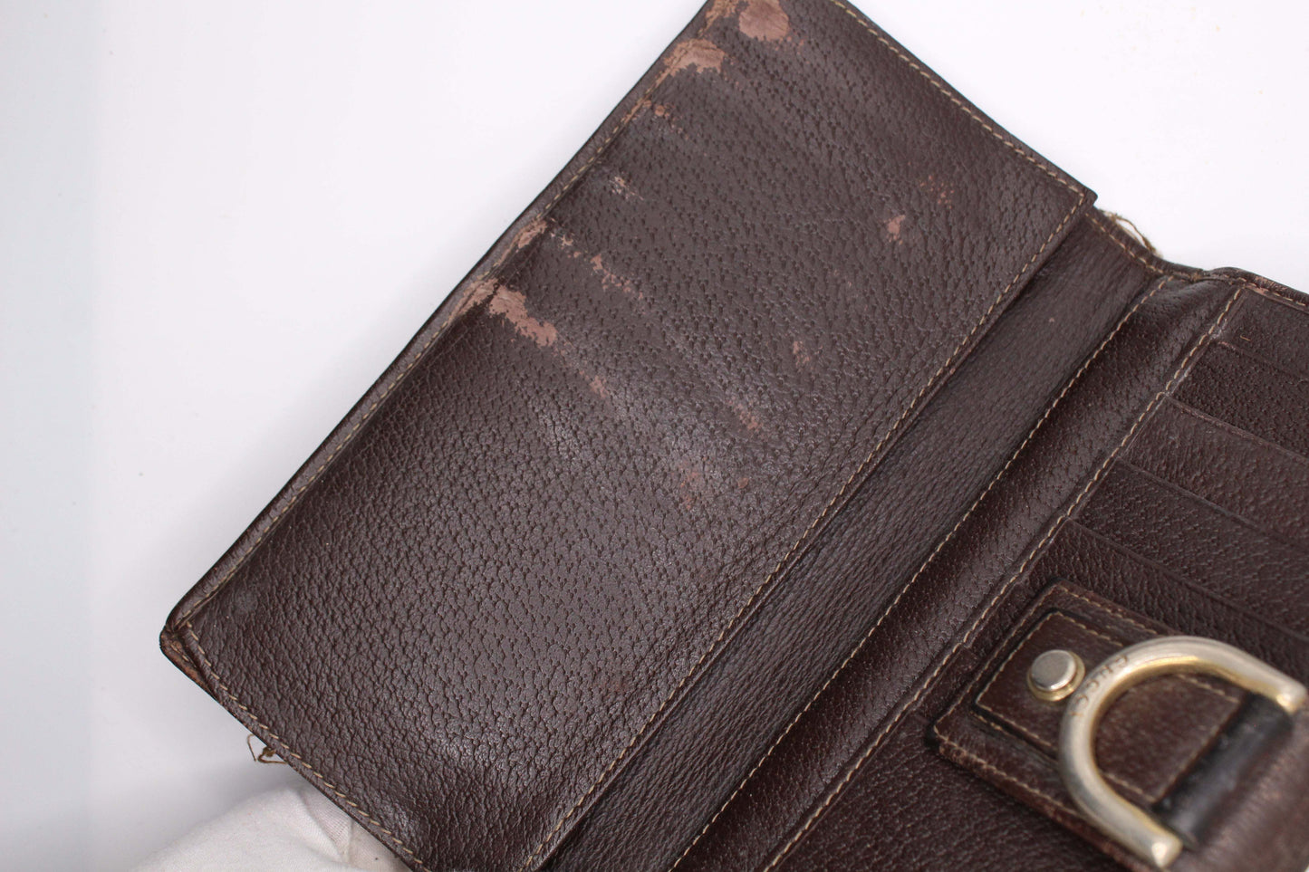 GUCCI Longwallet Monogram in Brown/Cream with visible wear, interior view showcasing leather material.