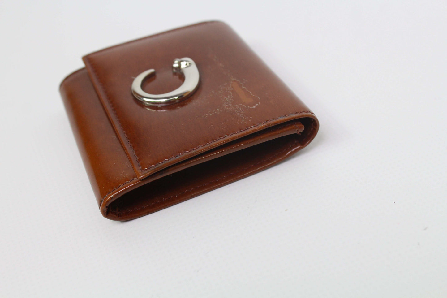 Cartier Portmonee Orange leather wallet, 8x8cm, dark orange with slight wear marks, includes box.