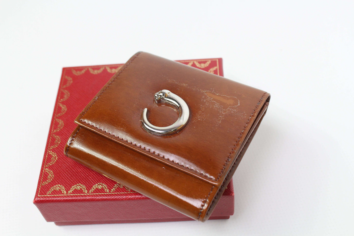 Cartier Portmonee Orange leather wallet, size 8x8cm, dark orange, with box and minor wear marks.