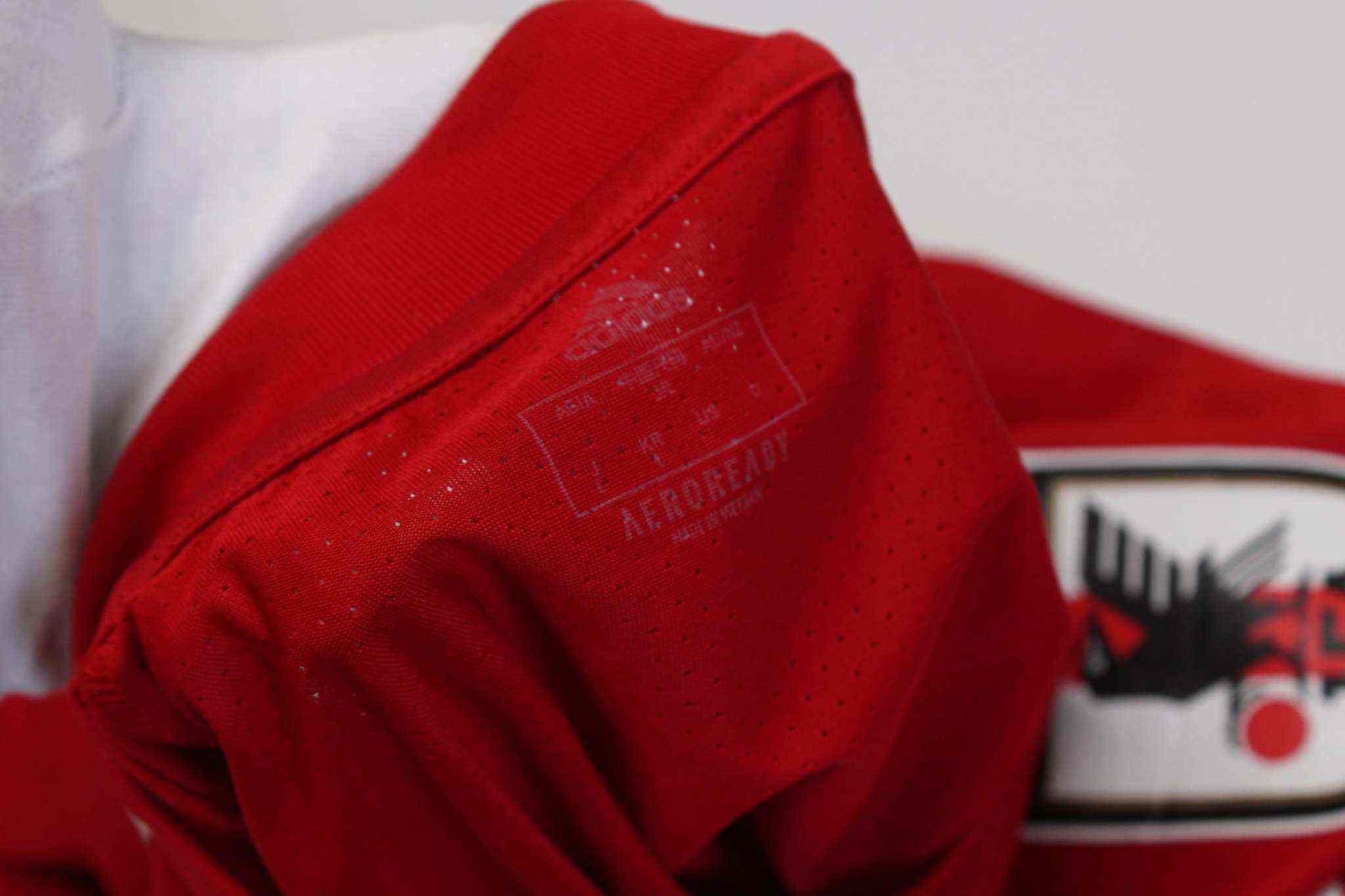 Red vintage Japan Trikot, size M, polyester material.