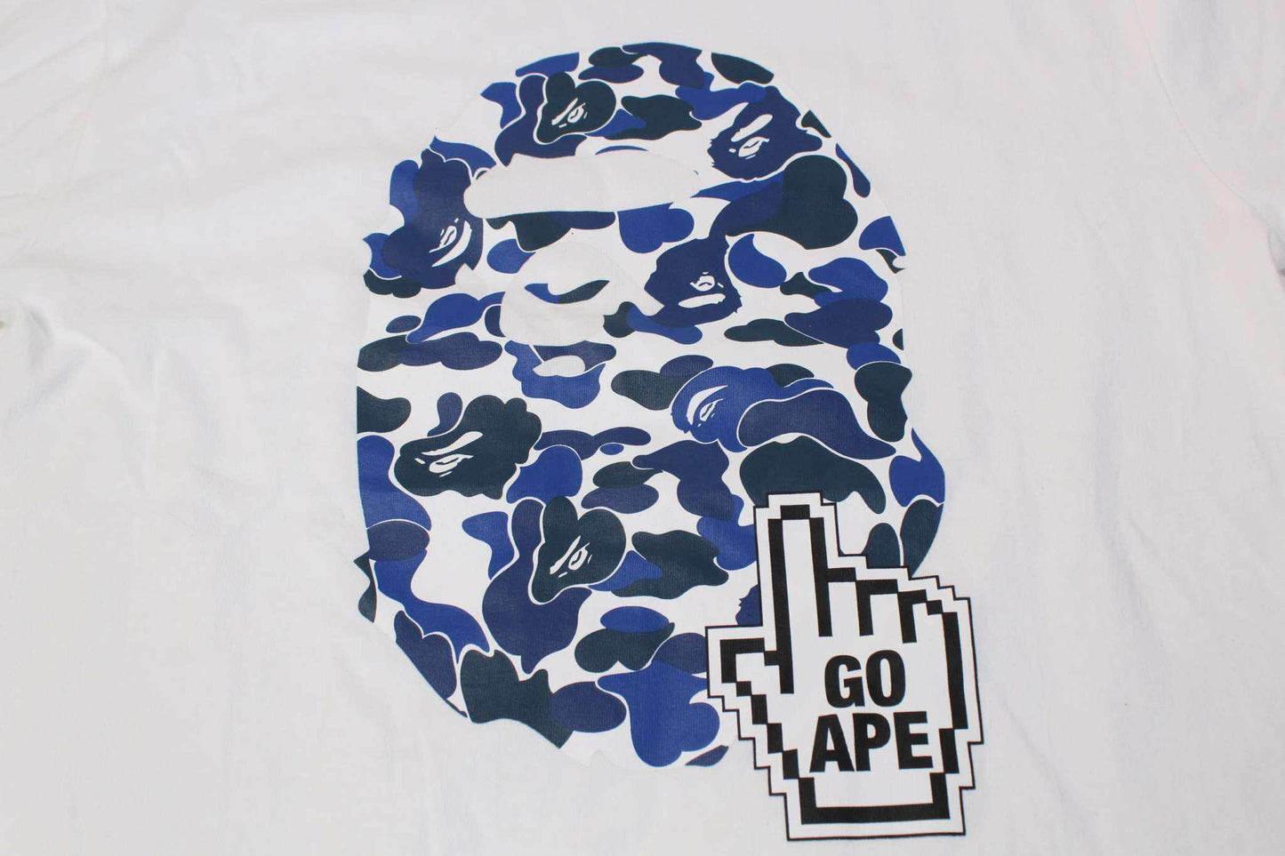 BATHING APE blue camo shirt with graphic logo.