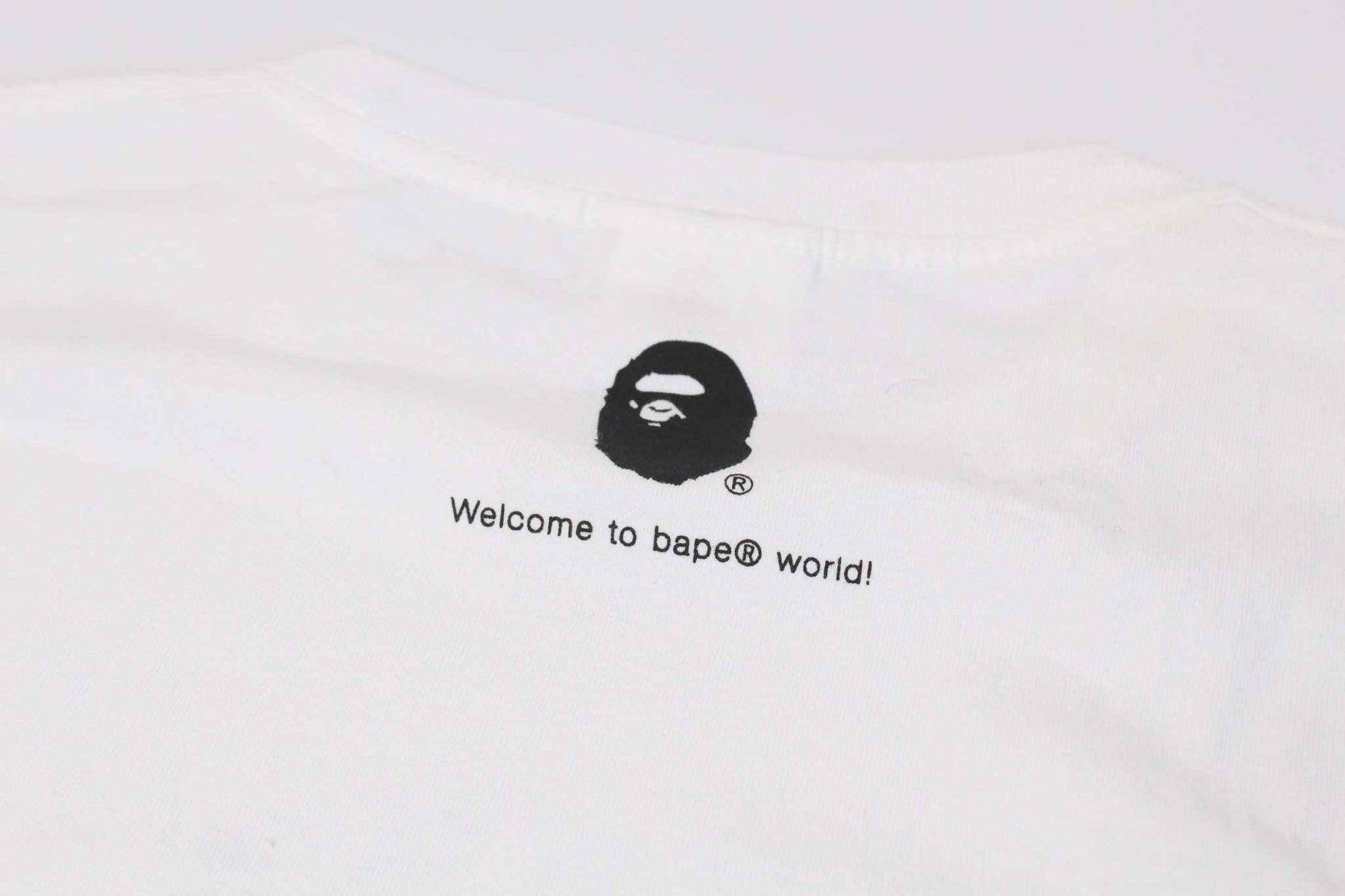 Blue camo BAPE shirt in medium size with distinctive ape logo on the back.