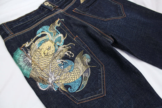 BIG TRAIN Koi embroidery denim jeans with colorful back pocket design.