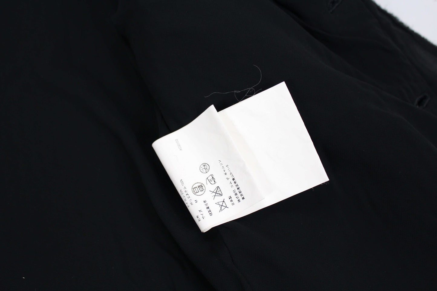 Comme des Garçons Tricot Jacket label and fabric details.