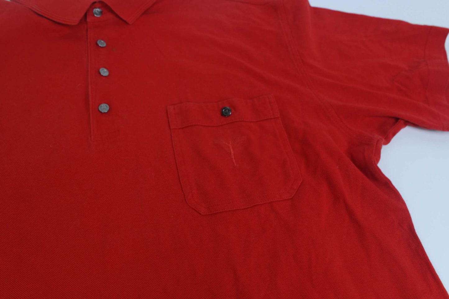 Carlo Colucci red shirt with button front and chest pocket.