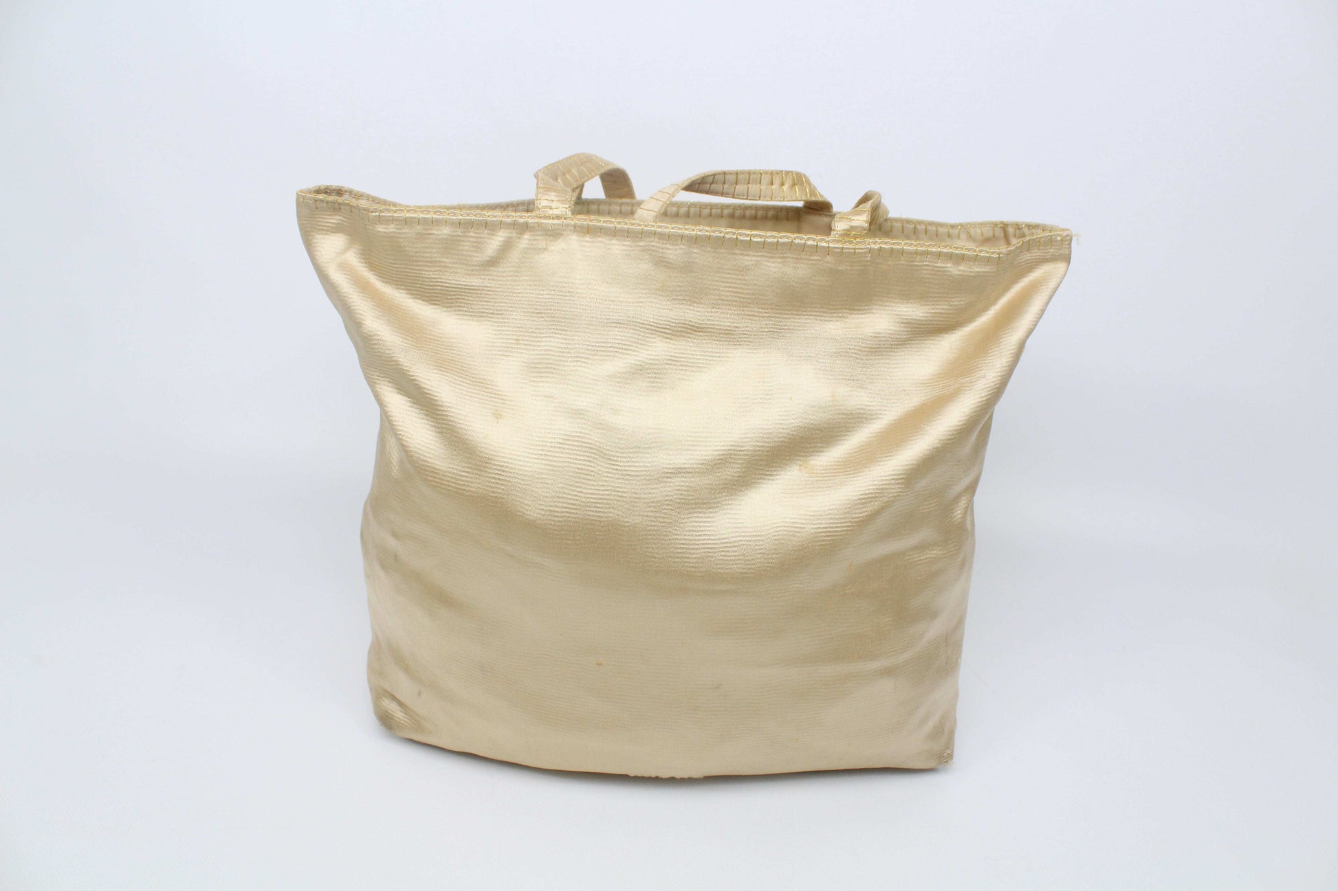 Prada Shopper Gold tote bag in beige/gold with visible signs of use.