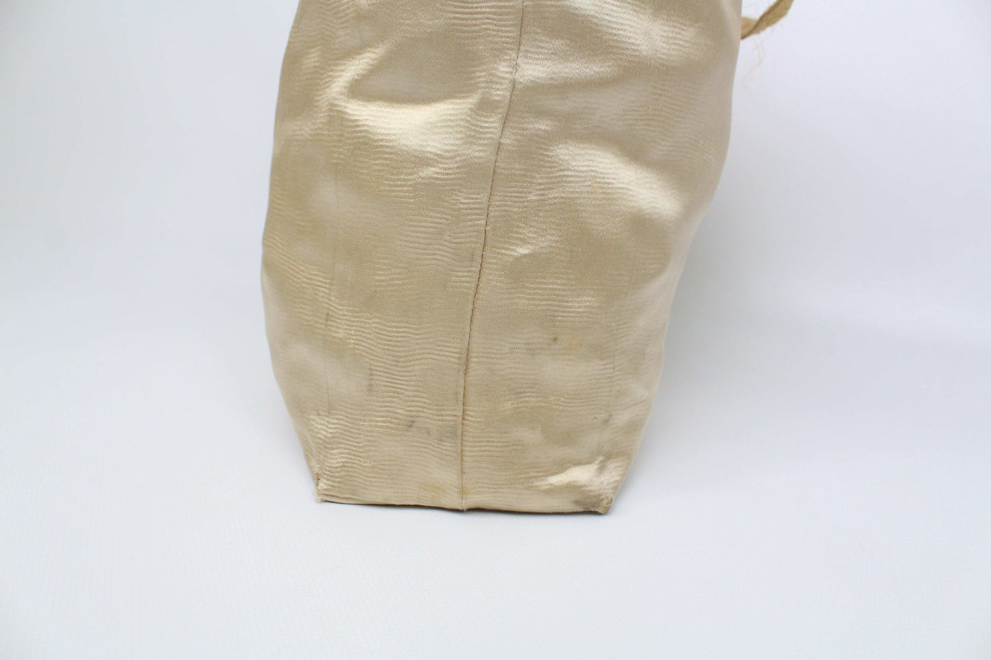 Prada Shopper Gold bag with beige exterior showing wear marks.