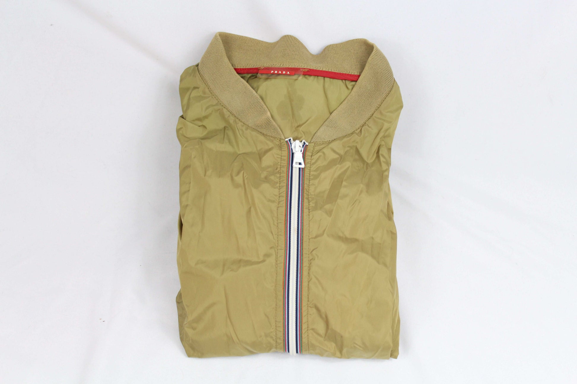 Prada Windbreaker, size S-M, 100% nylon, good condition with minor flaw.