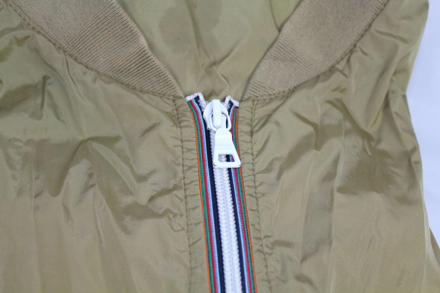 Prada Windbreaker in good condition, size S-M, 100% nylon with zip detail.