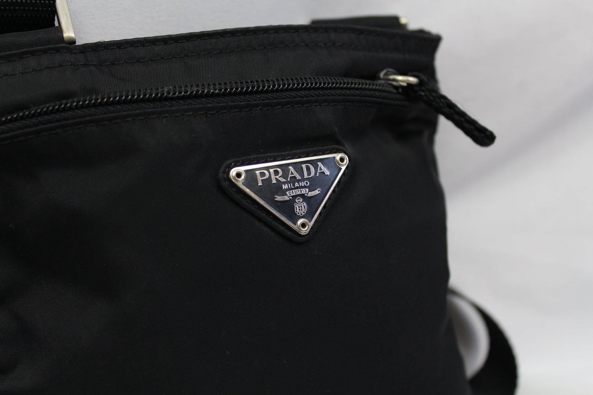 Prada Sling Bag Black Small, nylon material, close-up view.