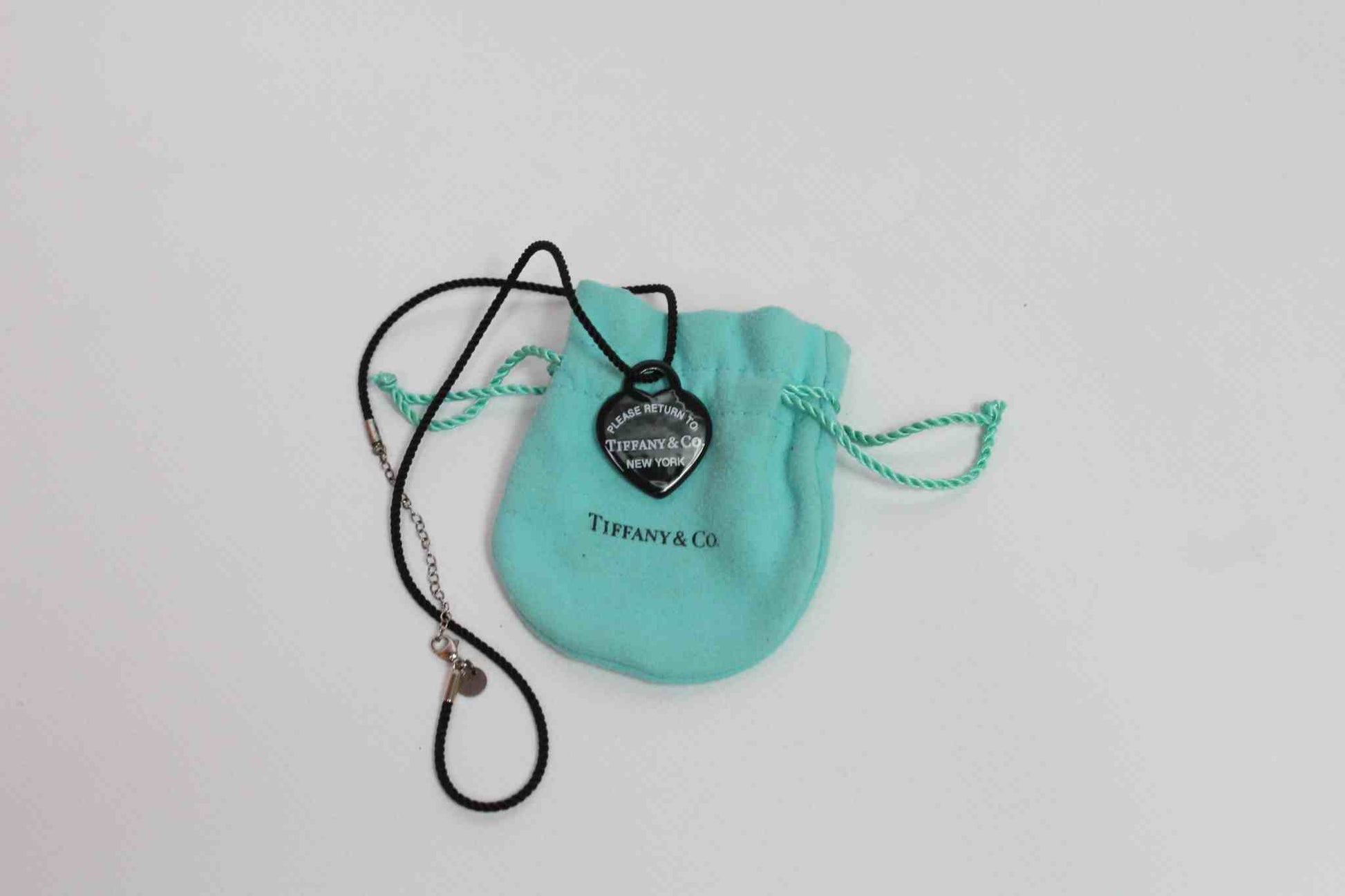 Tiffany & Co. heart dogtag necklace with pouch.