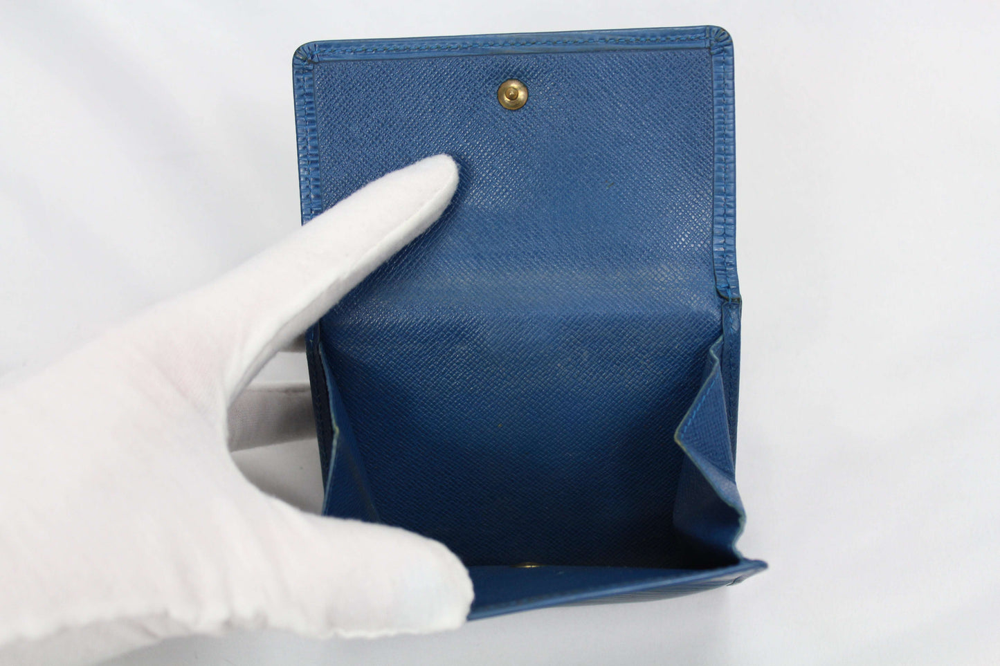 Louis Vuitton Epi Portmonee Blue wallet in good condition showing minor wear.