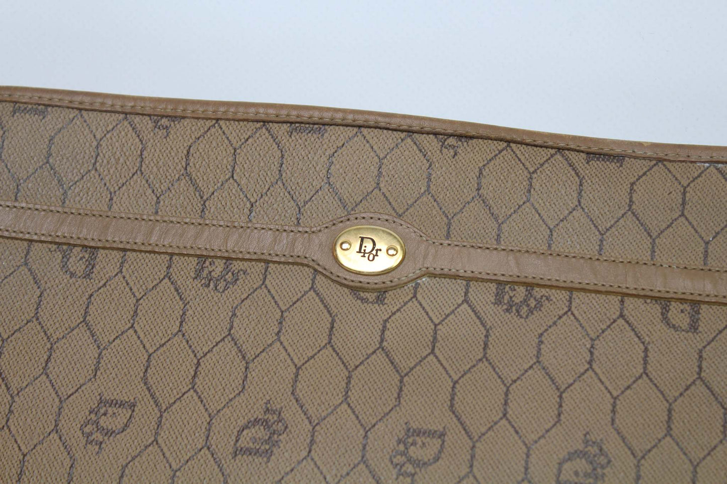 Beige canvas DIOR Clutch Honeycomb with monogram pattern.