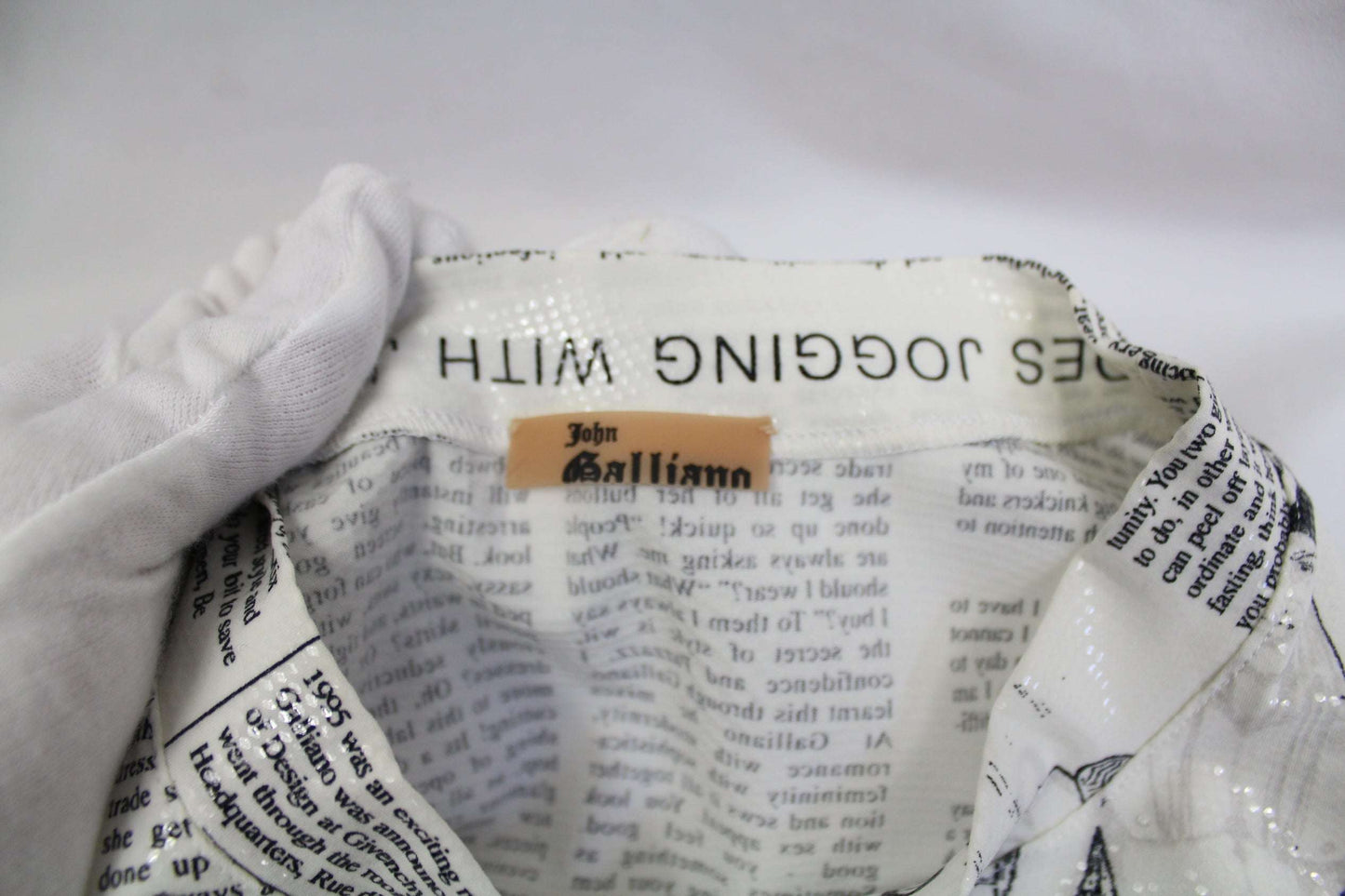 JOHN GALLIANO Newspaper Top with white, black, and neon accents, size 40, made of 72% nylon and 28% elastane.