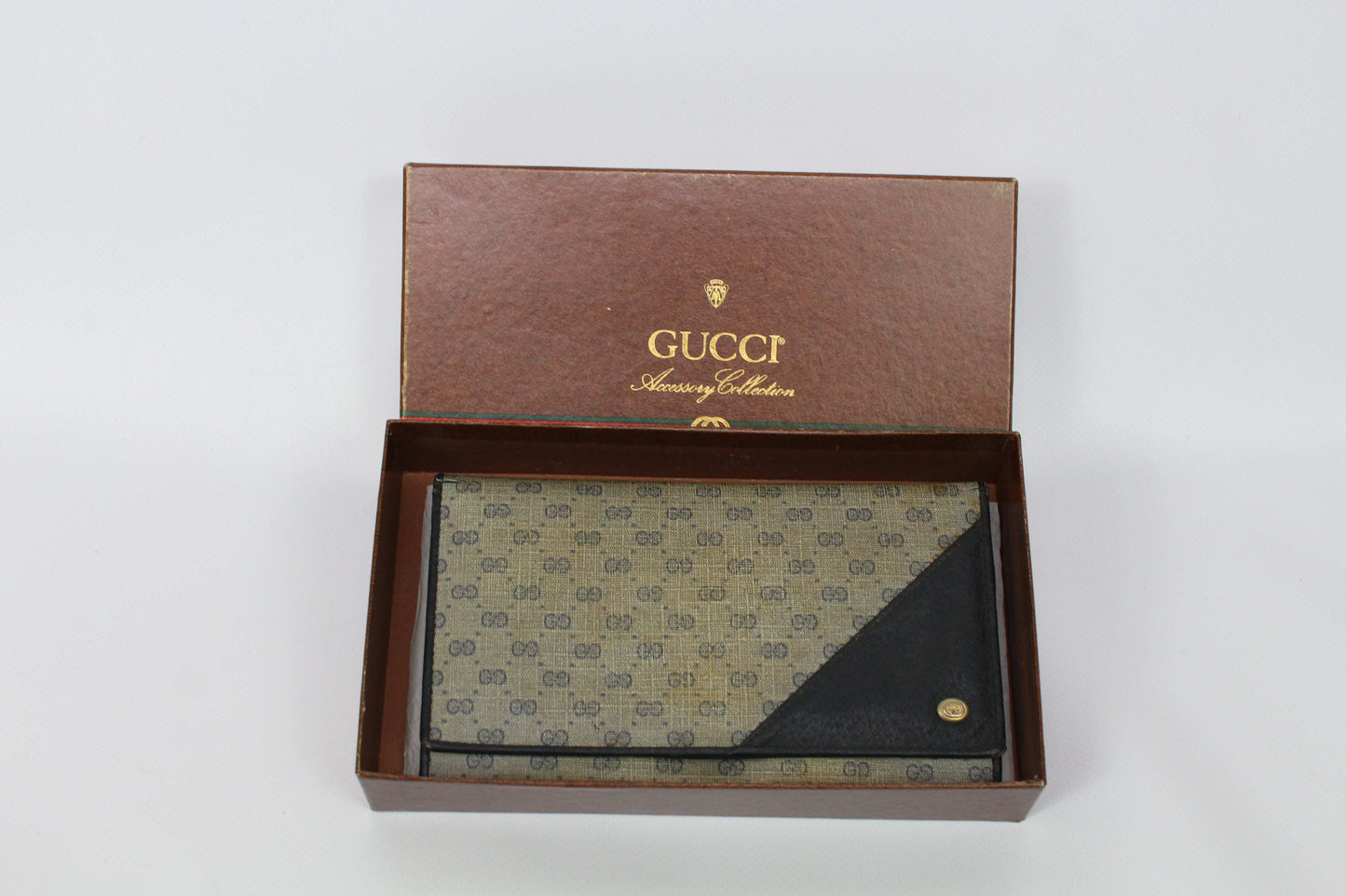 GUCCI Long Wallet in beige/brown canvas with leather trim, showing signs of use and slight canvas wear, includes box.