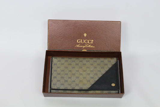 GUCCI Long Wallet in beige/brown canvas with leather trim, showing signs of use and slight canvas wear, includes box.