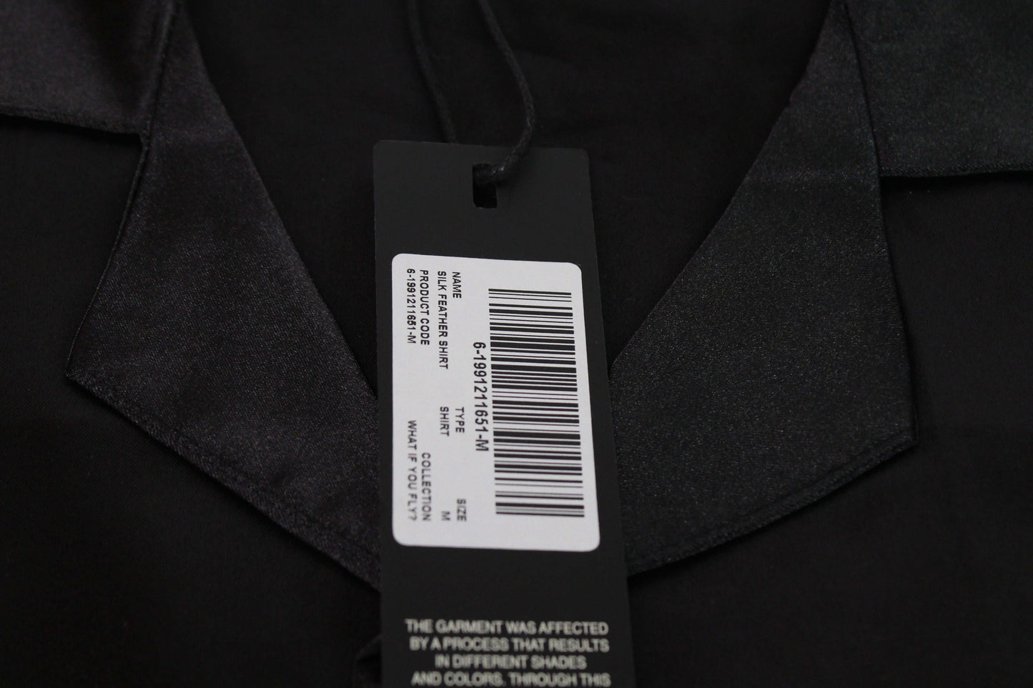 Black satin oversized shirt with a tag, new condition, ROUGH brand.