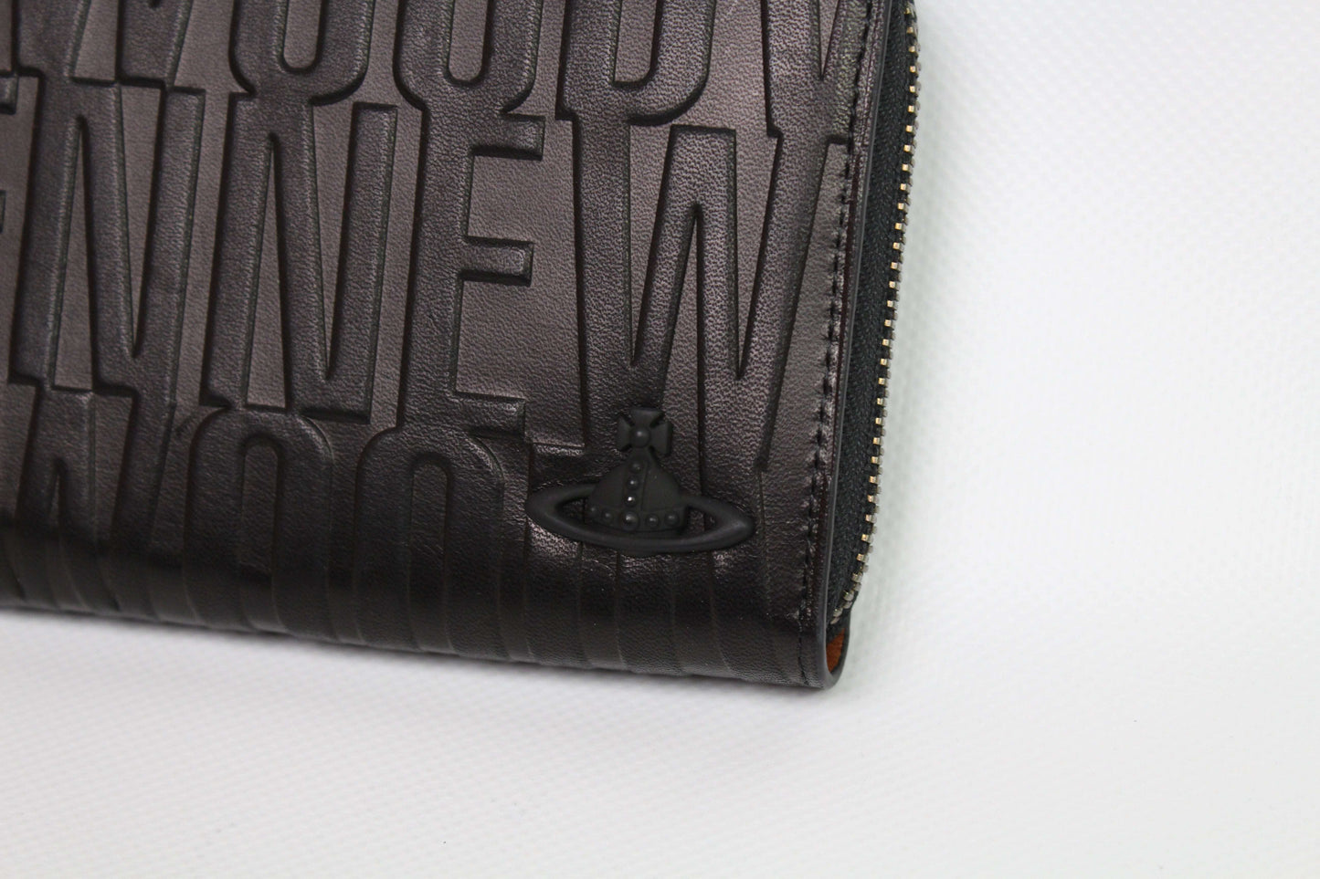 VIVIENNE WESTWOOD long brown leather wallet with embossed design.