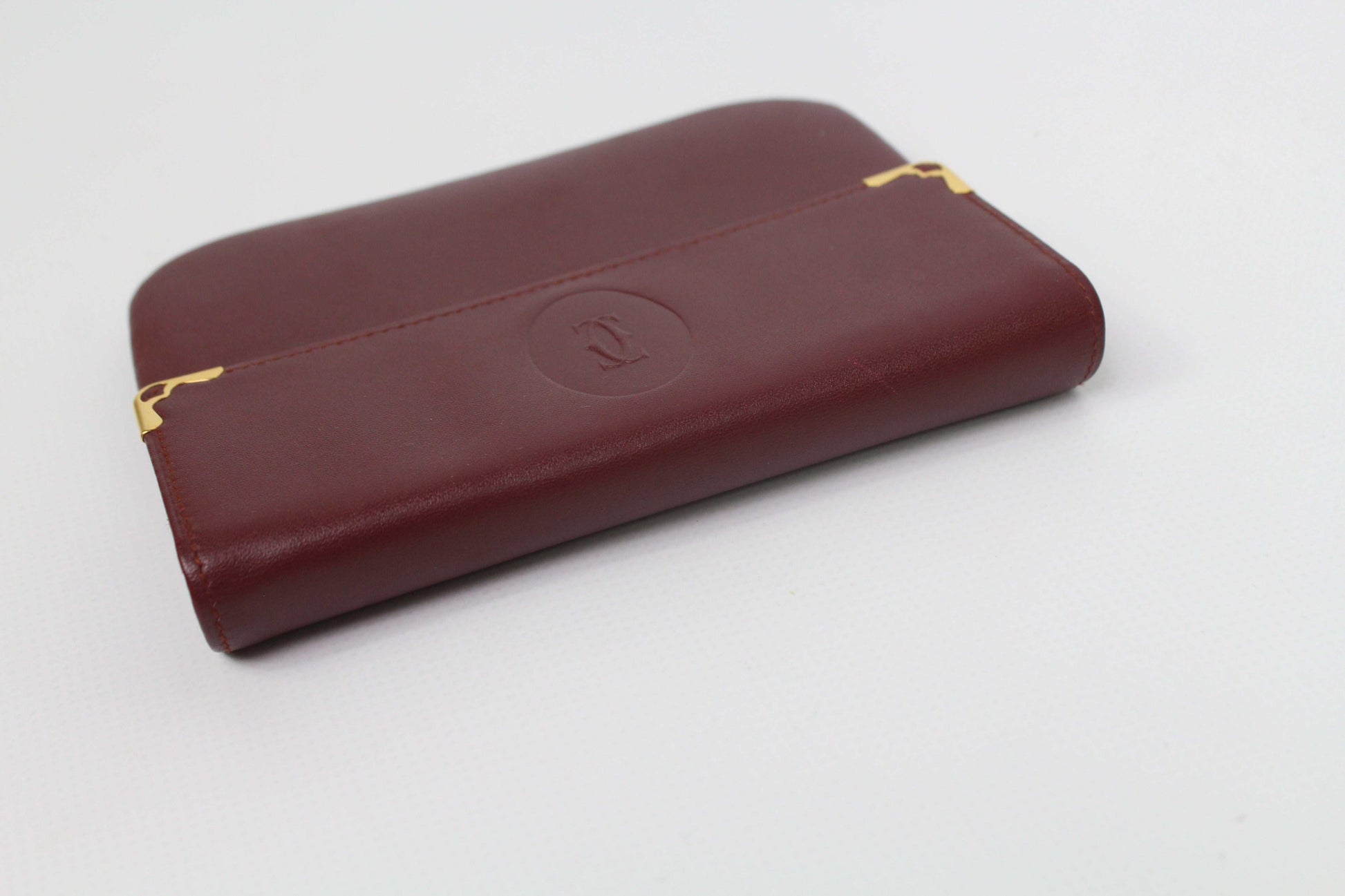 Bordeaux red Cartier Portmonee, leather, 16x10cm, condition 8/10, light wear, includes card.