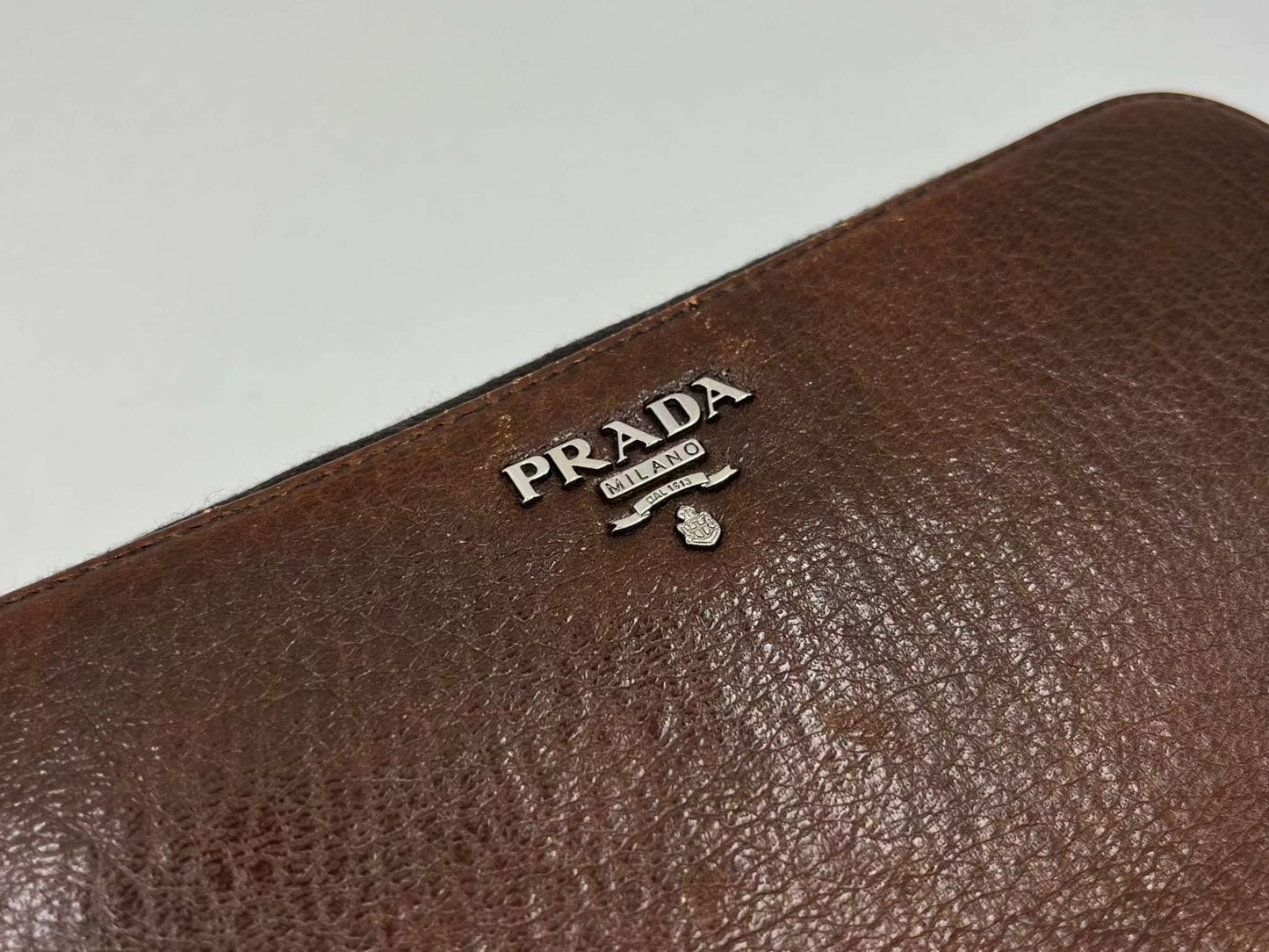 PRADA Leather Longwallet Brown with logo detail.