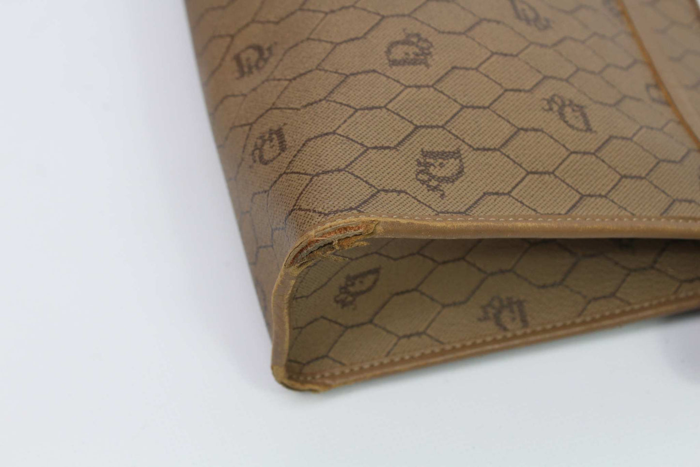 Beige Dior Clutch Honeycomb canvas with wear marks, condition 7/10.