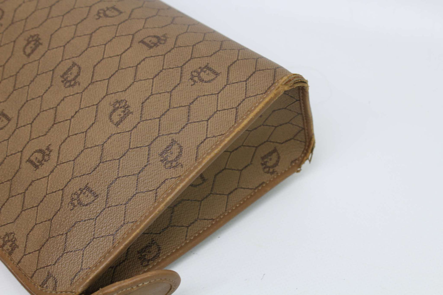 Beige Dior Clutch Honeycomb canvas with wear marks, condition 7/10.