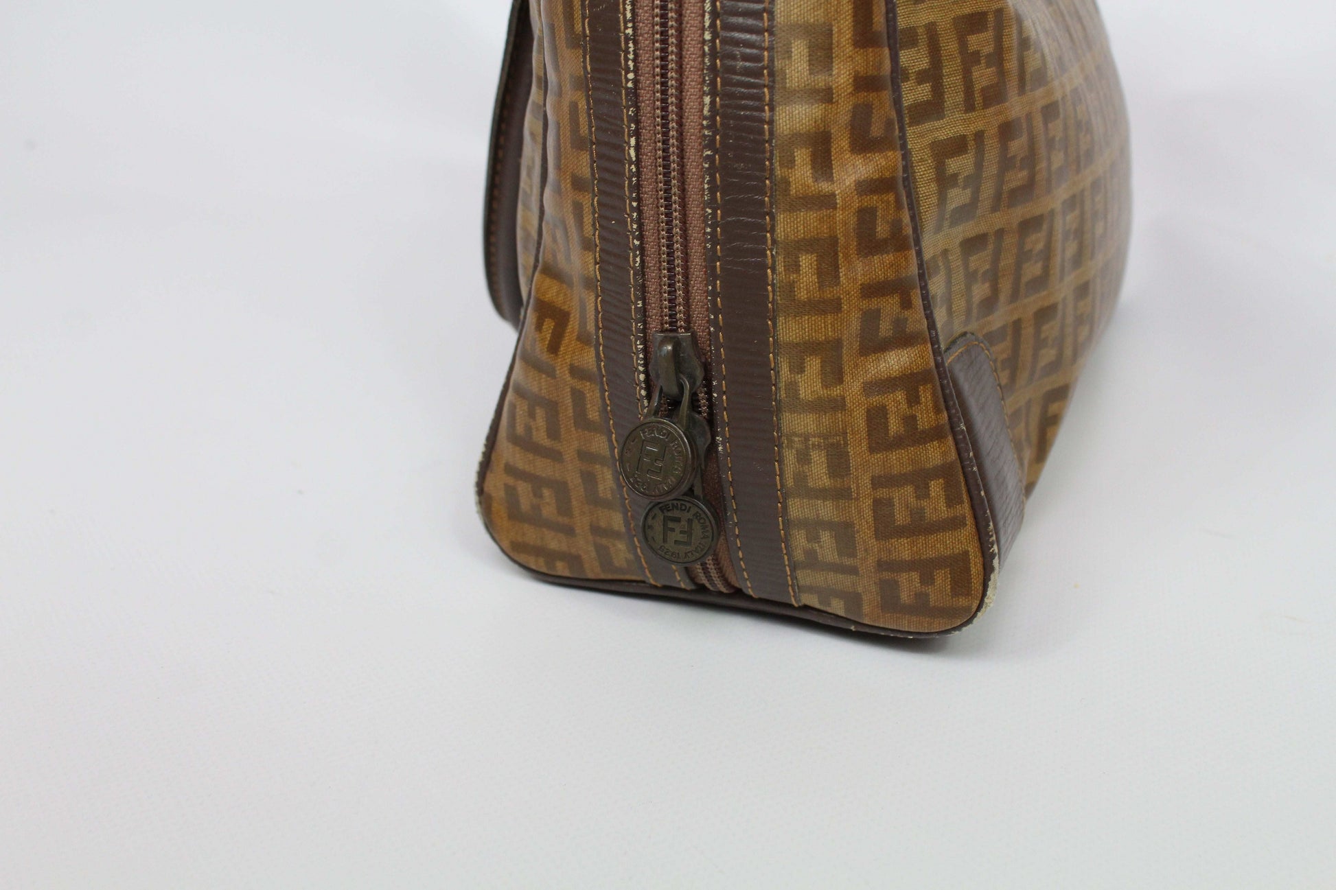 FENDI Bowlingbag Monogram in brown canvas with zipper detail.